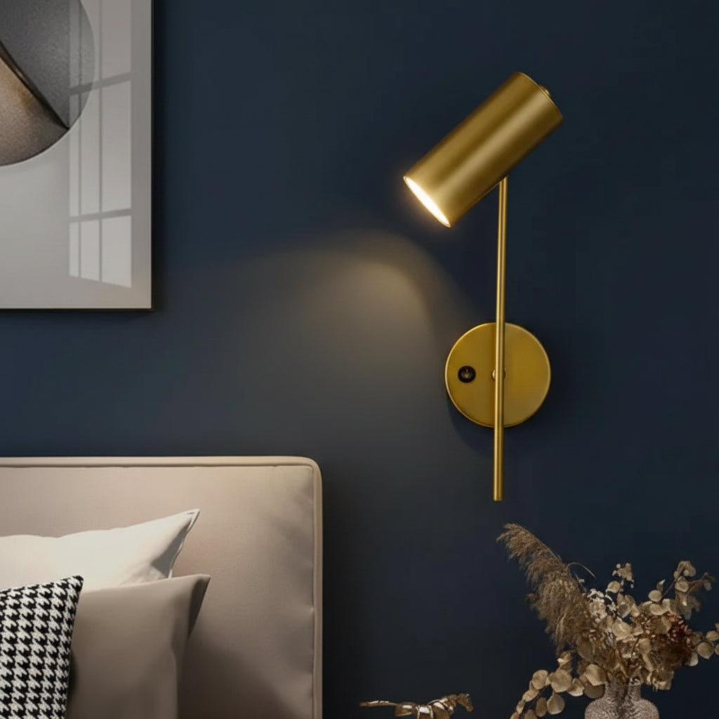 Gold swivel head wall spotlight with cylindrical shade and slim arm
