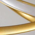 Gold metal ribbon bar detail with smooth curved finish