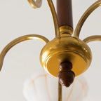 Brass chandelier center with rounded canopy and brown finial, curved arms