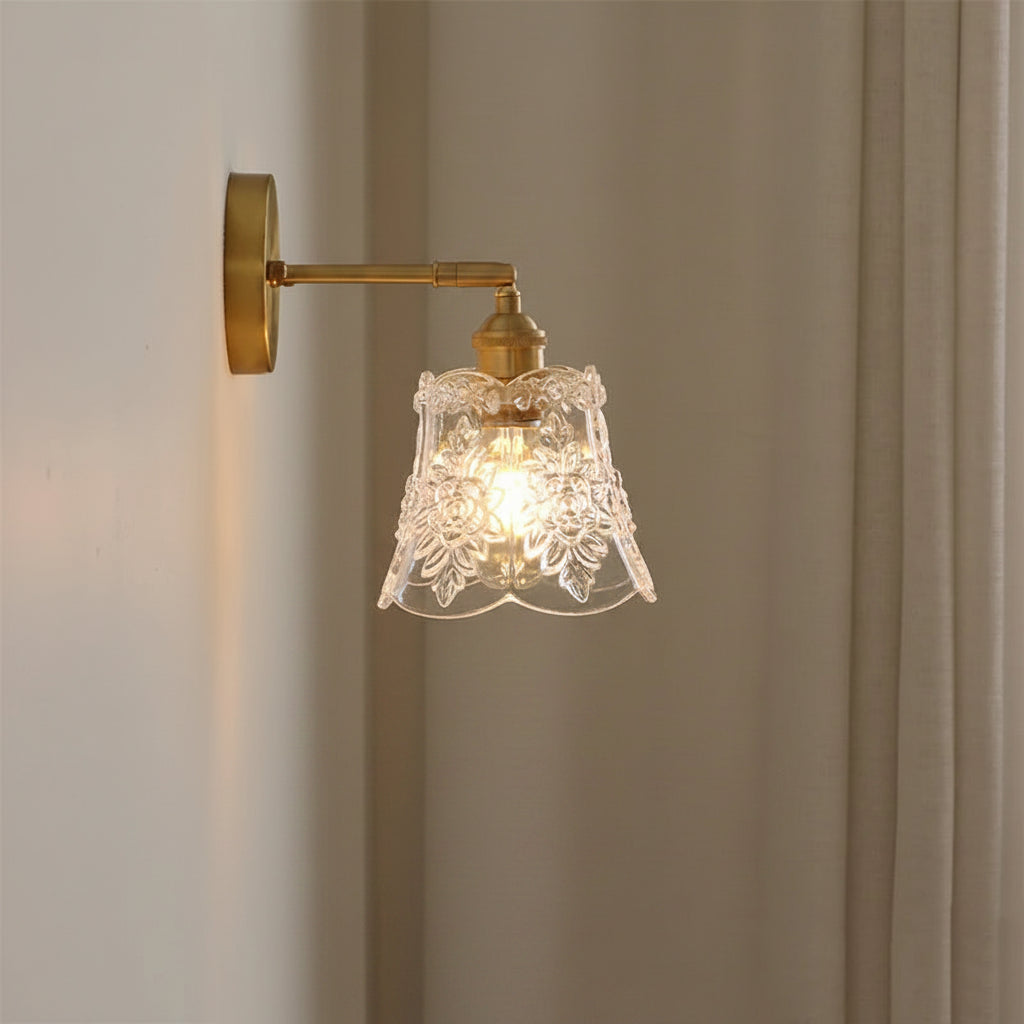 Vintage floral wall light with clear embossed glass shade and gold-tone wall mount