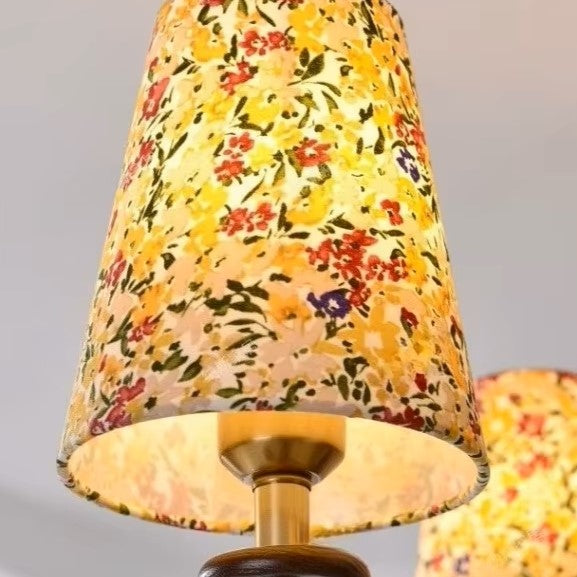 Close-up of a conical botanical floral lampshade with warm interior trim