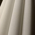 Cream pleated fabric lamp shades with fine vertical texture