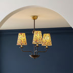 Multi-arm conical chandelier with dark metal frame and botanical floral fabric shades