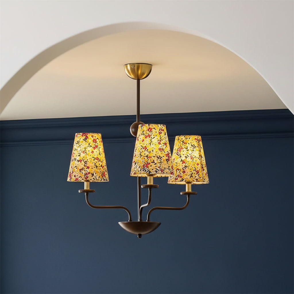 Multi-arm conical chandelier with dark metal frame and botanical floral fabric shades