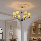 Ceiling-mounted chandelier with conical botanical floral shades and a brass central mount