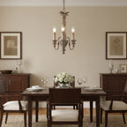 Vintage rustic spindle chandelier with three candle-style lights and scroll arms
