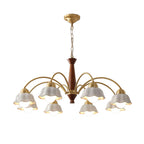 Gold multi-arm chandelier with brown central column and five white scalloped bell shades.