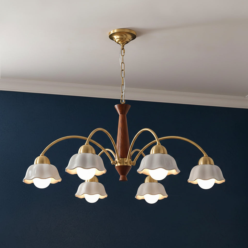 Ceiling-hung chandelier with gold top, brown center column, and five white scalloped shades.