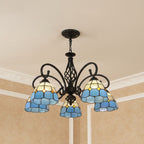 Black metal branch chandelier with 5 blue stained-glass bell shades and central harp