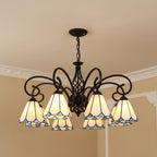 Black bell shade chandelier with blue stained-glass shades and ornate metal arms
