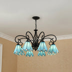 Black metal branch chandelier with 6 blue stained-glass bell shades and curled arm details