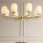 Sputnik-style chandelier canopy with multiple frosted glass shades and gold arms