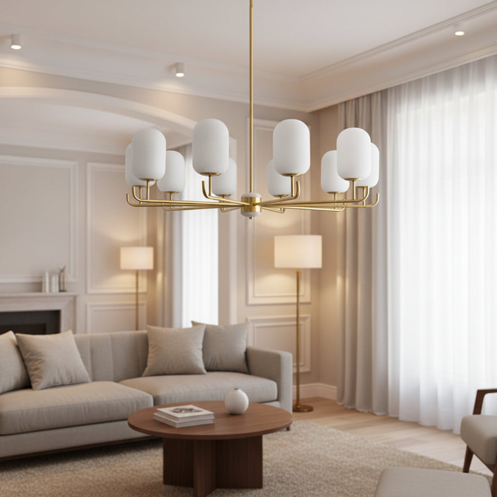 Hanging chandelier with frosted glass shades and gold metal frame in a living room
