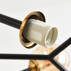 Bubble orb chandelier socket detail: black arm with gold rim and ribbed white bulb holder