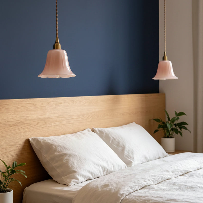 Set of pink opaline bell-shade pendant lights with twisted cords and brass caps