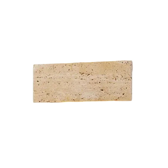 Rectangular travertine wall light sconce with textured stone faceplate, unlit