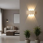 Rectangular travertine wall sconce with warm light glowing upward and downward