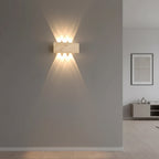Rectangular travertine up-and-down wall sconce with warm glow