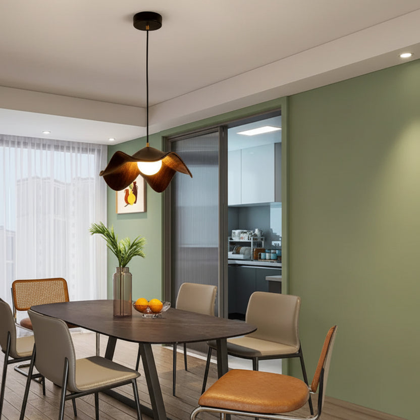 Wood grain lotus leaf pendant light hanging above a dining table