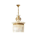 Gold-tiered crystal prism pendant light with drum shade and hanging chain