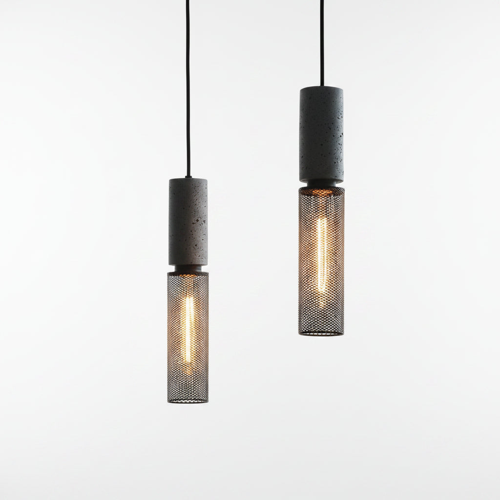 Tubular cage pendant light with dark speckled cylinder housing and warm glowing filament bulb