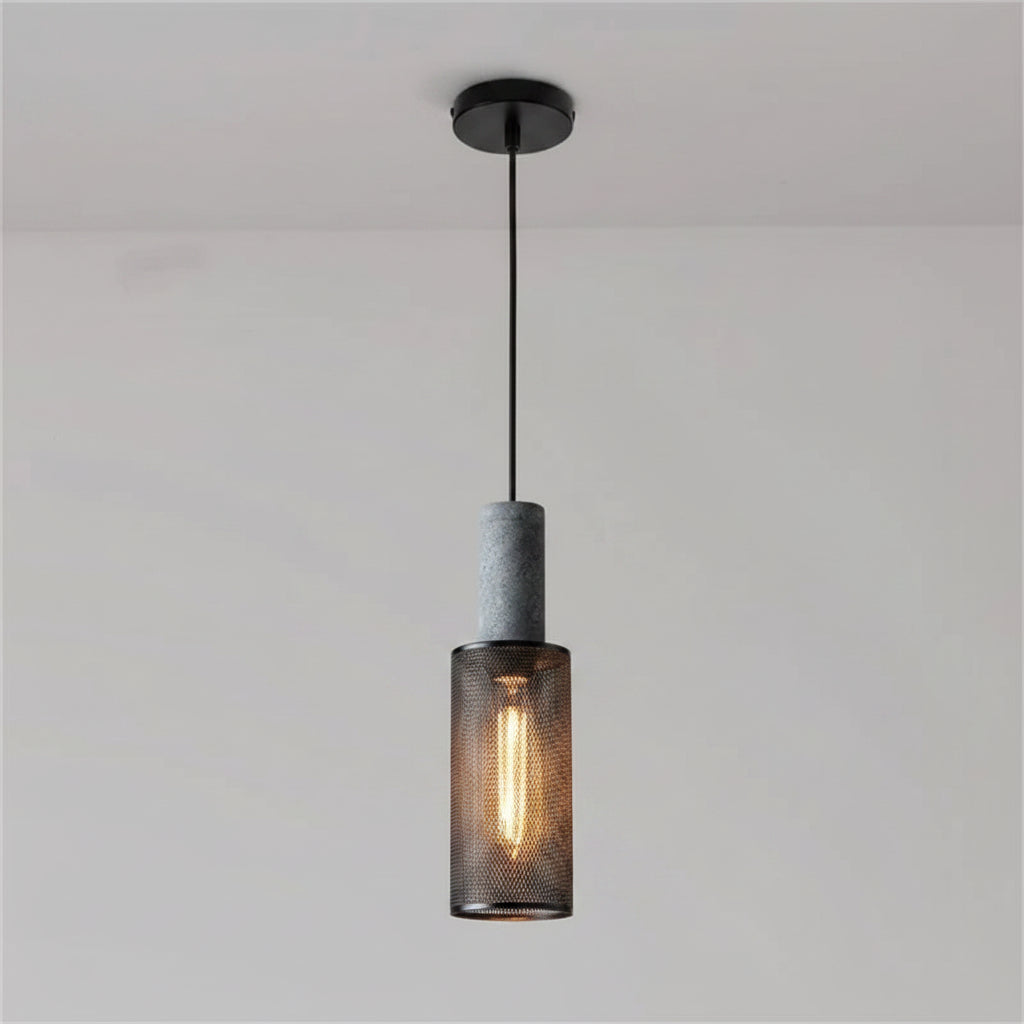 Tubular cage pendant light with dark speckled cylinder top and warm glowing filament bulb