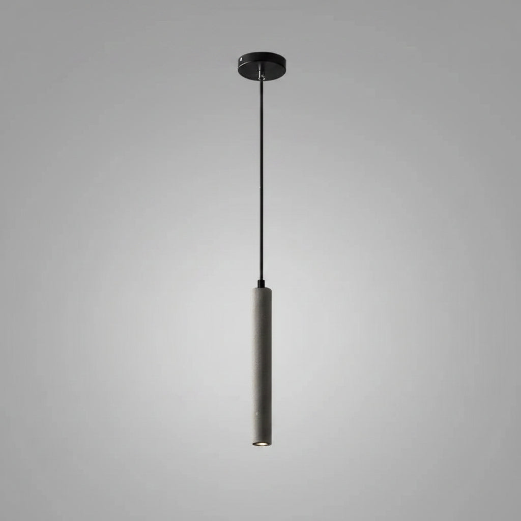 Tubular pendant light with black ceiling canopy, long cord, and speckled gray tube