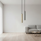 Two speckled cylindrical pendant lights: cream and gray on black cords.