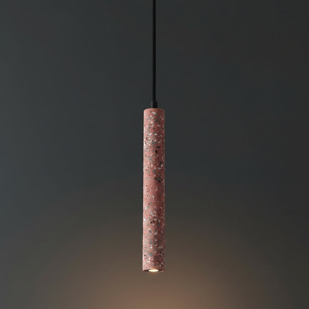 Red speckled cylindrical pendant light with black cord and downward light.