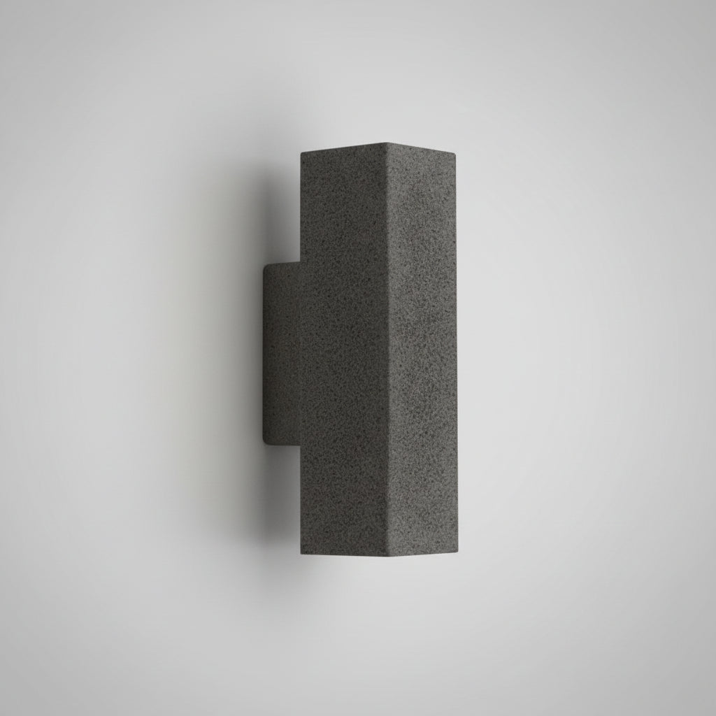 Concrete wall light with cylindrical shade, dark speckled finish and square mounting backplate