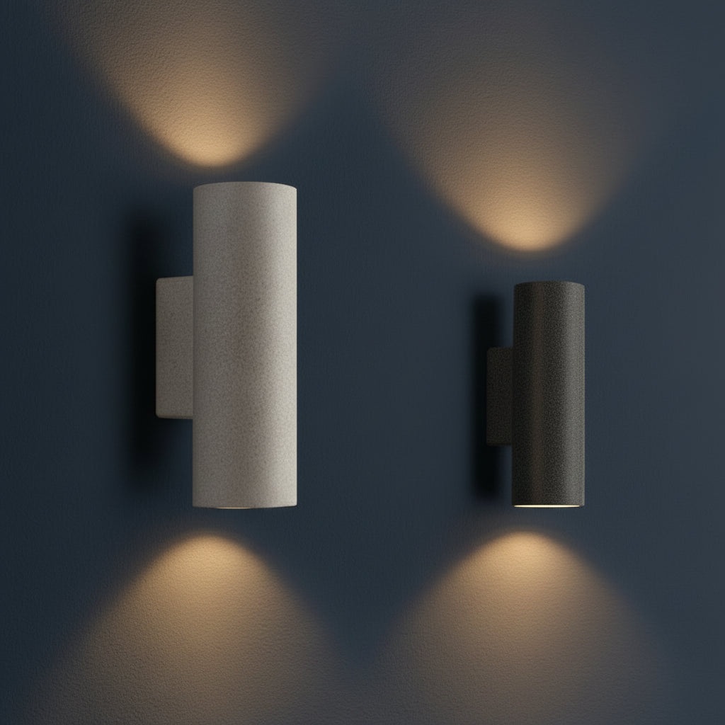 Pair of concrete wall lights with cylindrical shades in light and dark finishes