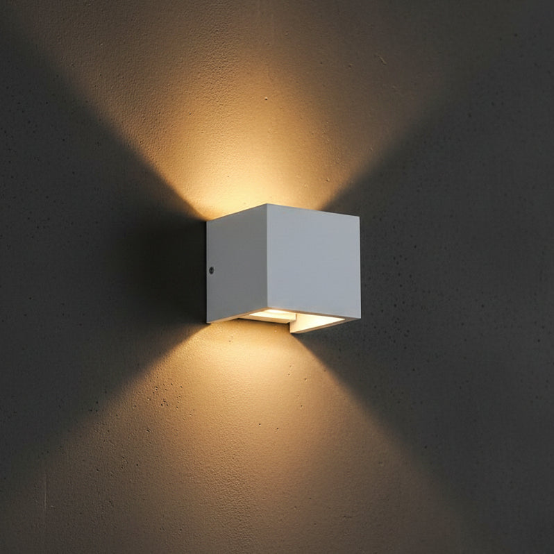 Square concrete wall light with white diffuser, mounted on wall