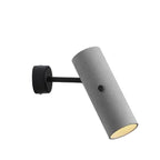 Rotatable tubular wall light, grey speckled housing, black backplate mount, downlight