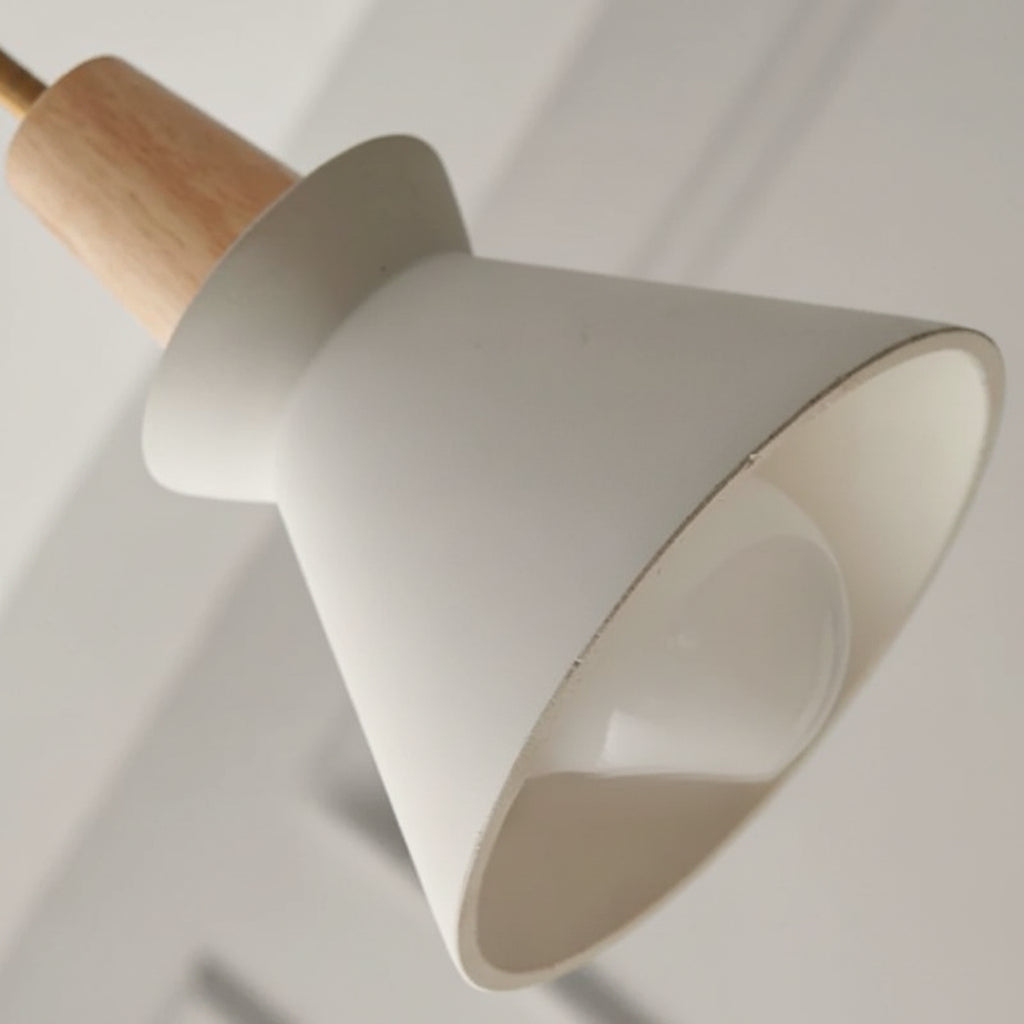 Pendant light shade close-up: white cone with curved opening and light gray top
