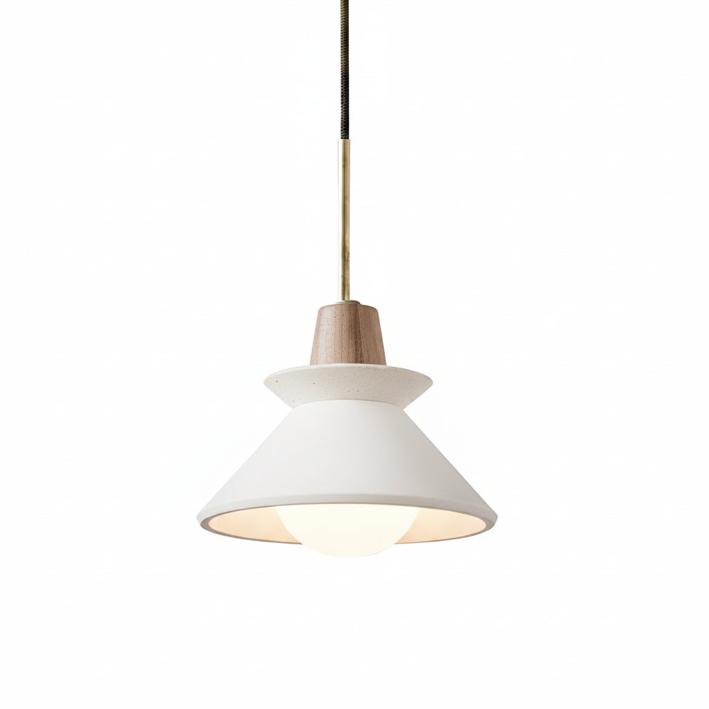 Pendant light with white cone shade and gray concrete canopy, brass hanging cord