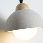 Speckled gray pendant light shade with warm-lit bulb