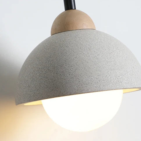 Speckled gray pendant light shade with warm-lit bulb