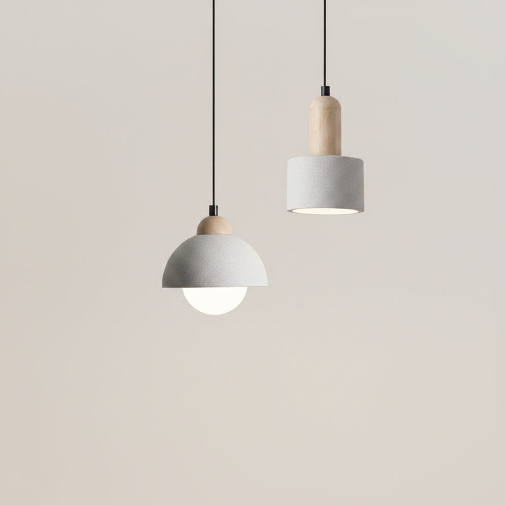 Cylindrical pendant light with gray shade and cork cap, black cord
