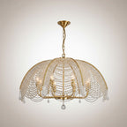 Umbrella-style crystal chandelier with gold canopy, beaded dome shade, and hanging drops