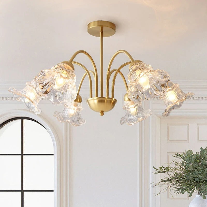 Brass 6-light scalloped flower chandelier with curved arms and clear glass shades