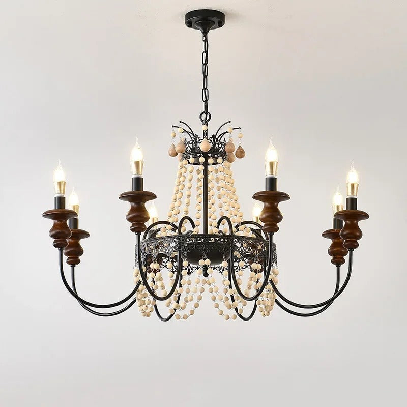 Black candle-style chandelier with dark wood candle cups and hanging wood bead strands