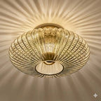 Amber fluted saucer ceiling light with ribbed glass shade and central round opening