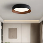 Black shallow dome ceiling light with white diffuser and wood-toned inner ring