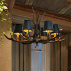 Antler-style chandelier with dark bell shades and warm-lit candle bulbs