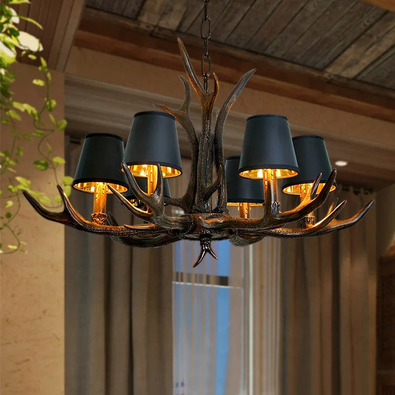 Antler-style chandelier with dark bell shades and warm-lit candle bulbs