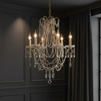 Gold-tone candle chandelier with ornate arms and long teardrop crystal strands