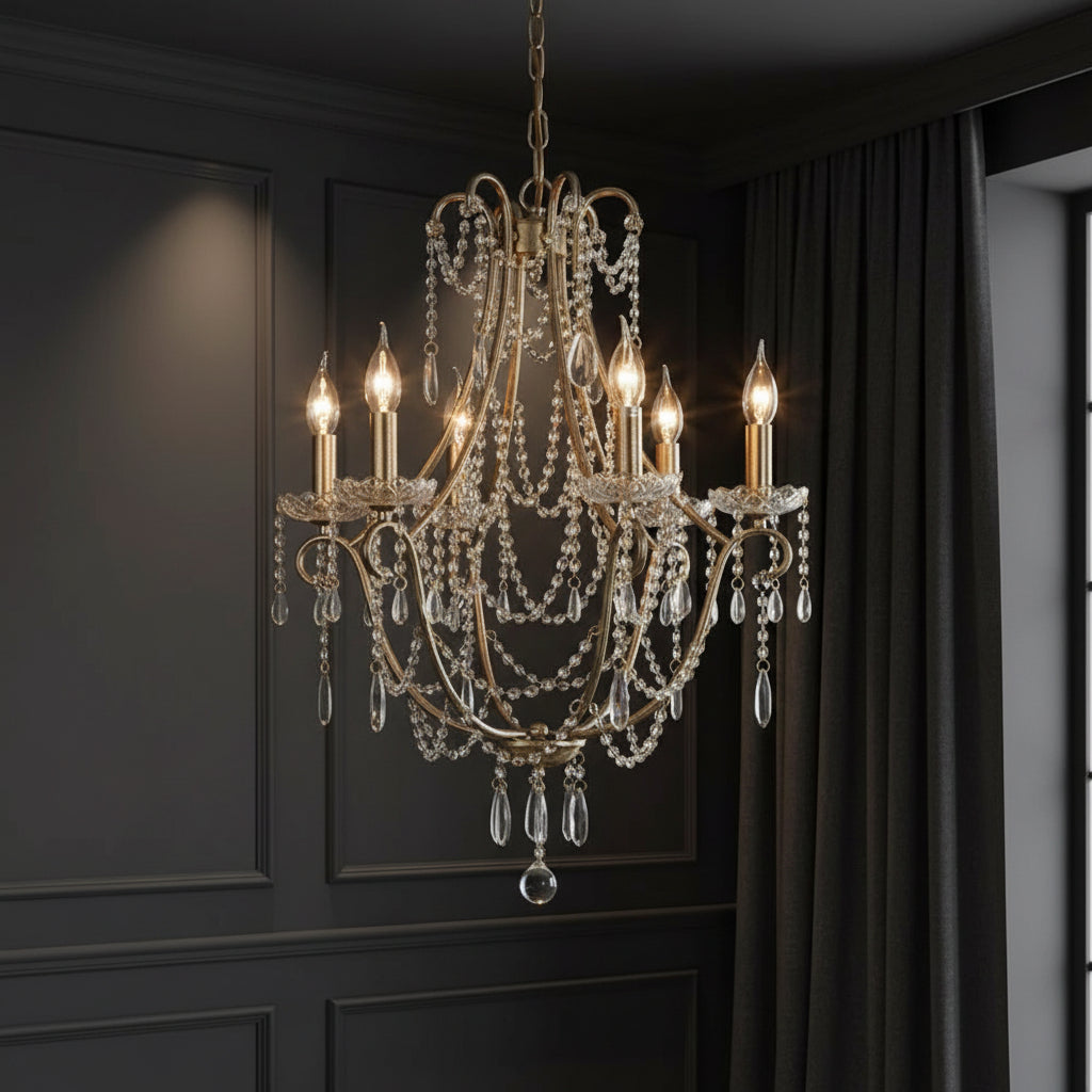 Gold-tone candle chandelier with ornate arms and long teardrop crystal strands