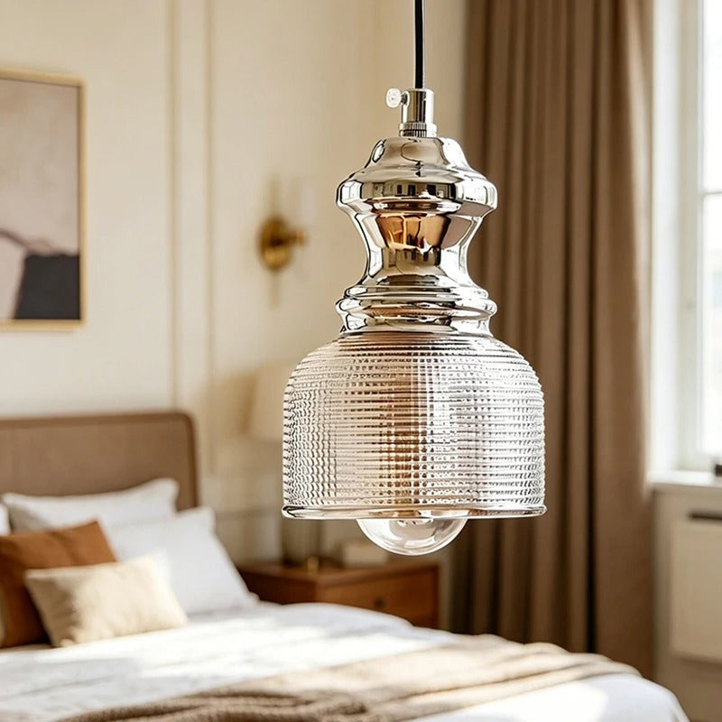 Bell-shaped pendant light with clear ribbed glass shade and chrome top