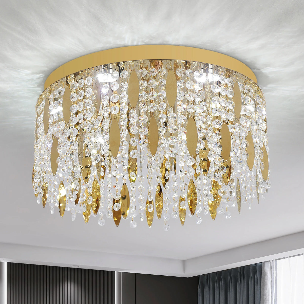 Round flush-mount crystal ceiling light with gold rim and dangling leaf prisms