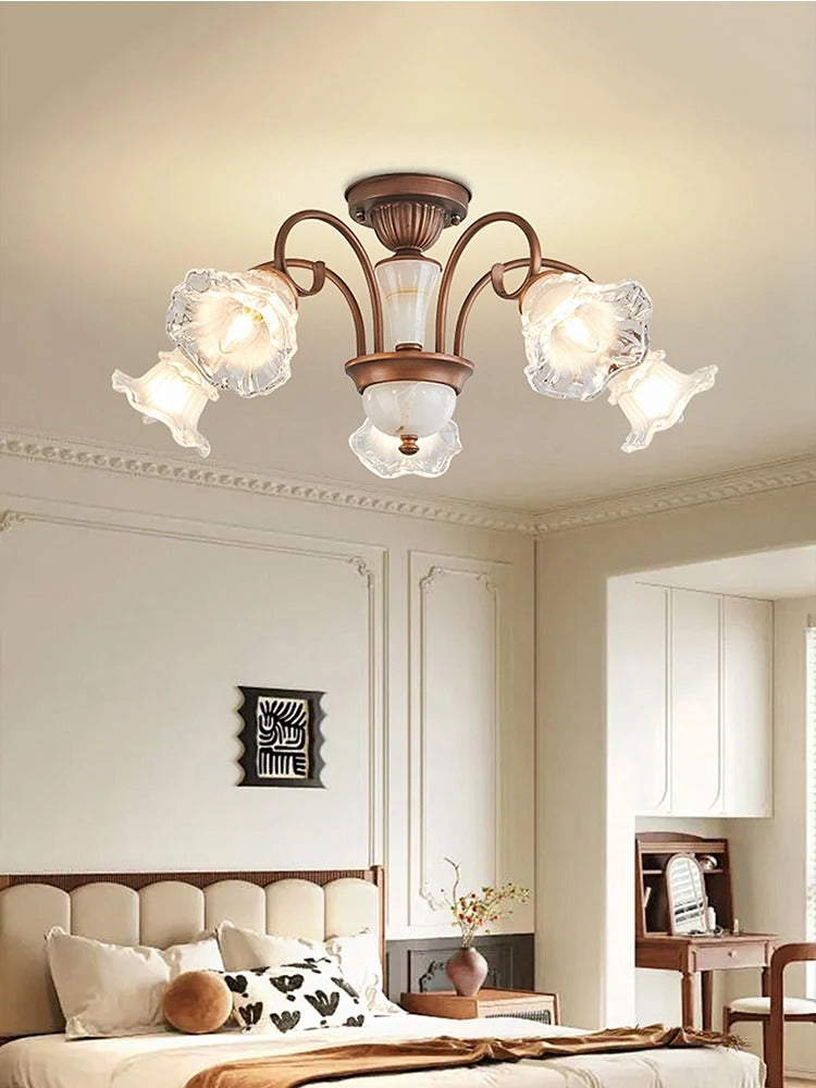 Antique floral 3-light ceiling light with bronze arms and frosted glass shades